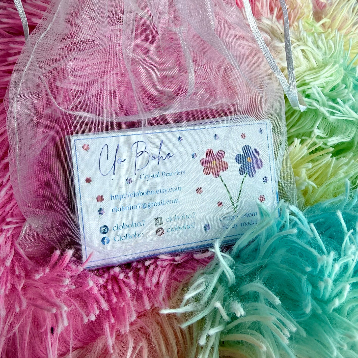Printed contact card with Jo Bobo info in pastel shag pouch