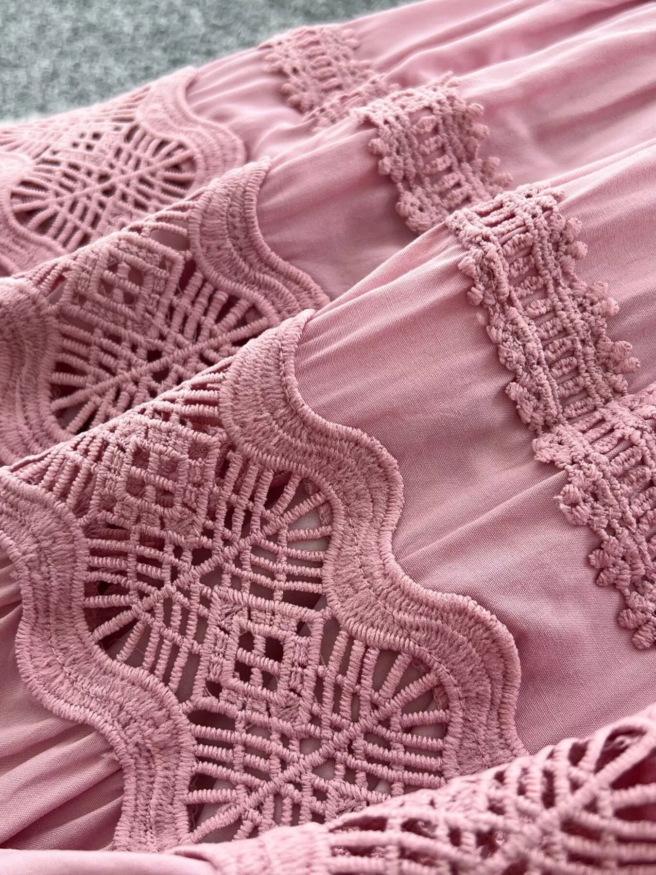 Pink boho skirt detail: embroidered lace appliques and scalloped edge