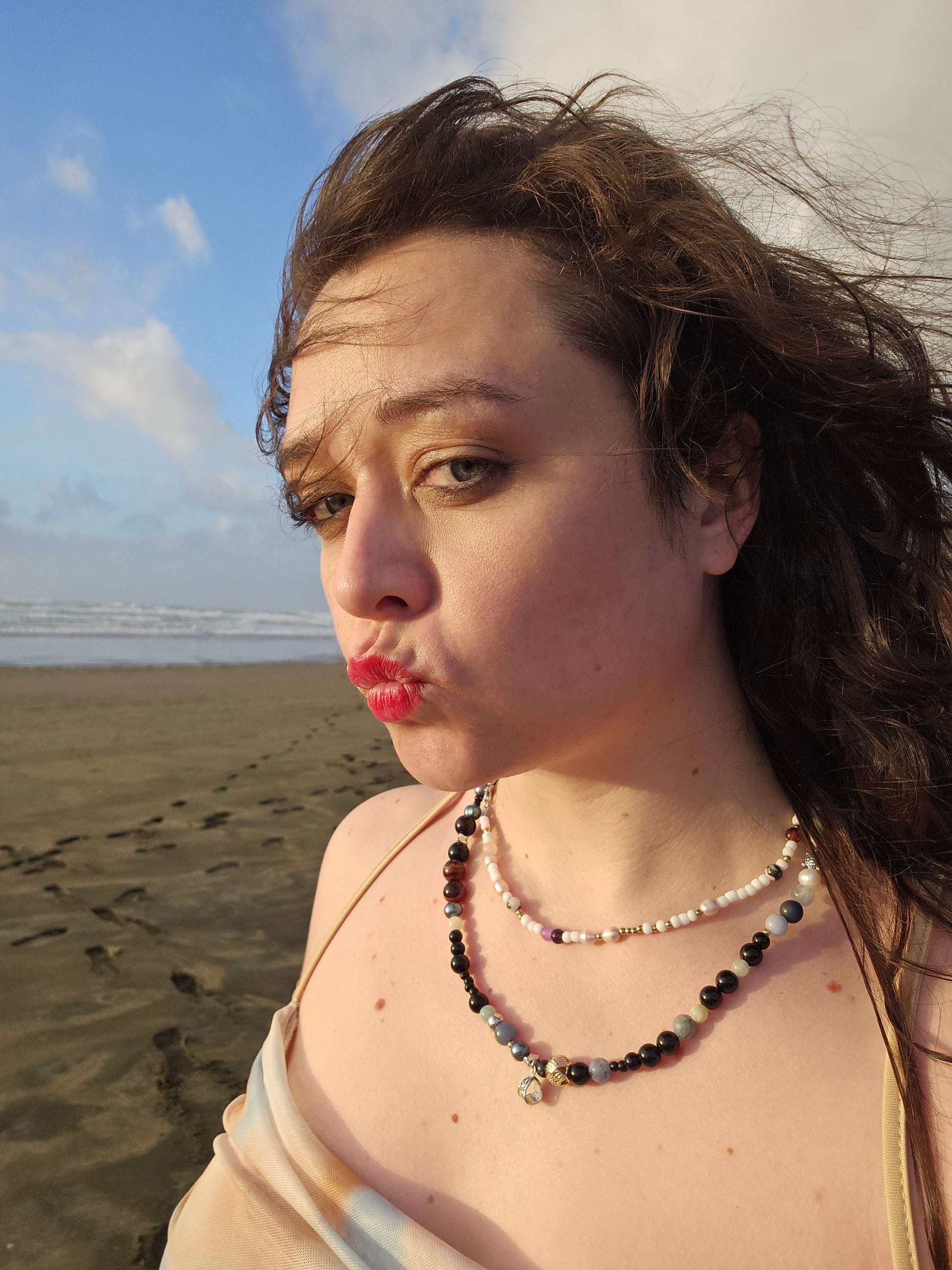 Woman on a beach with a clear sky