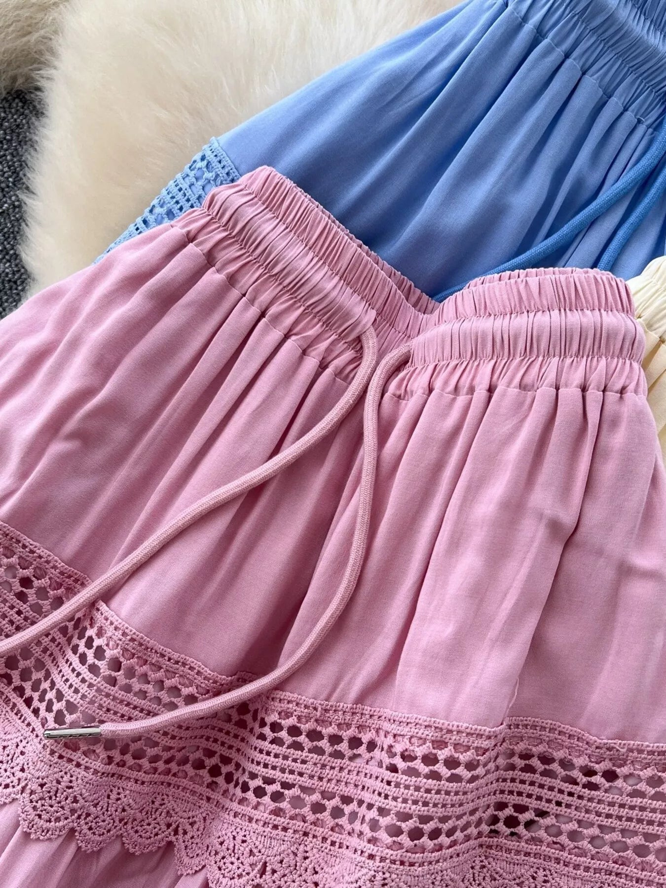 Pink skirt with elastic waist, drawstring, and lace crochet border