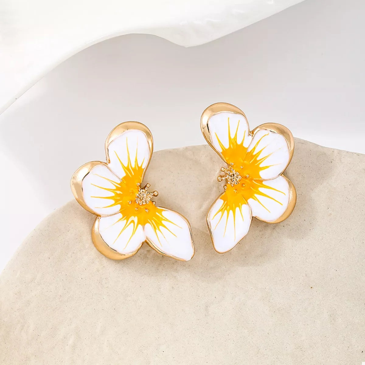 Orange butterfly stud earrings with white petals and gold-tone butterfly frames