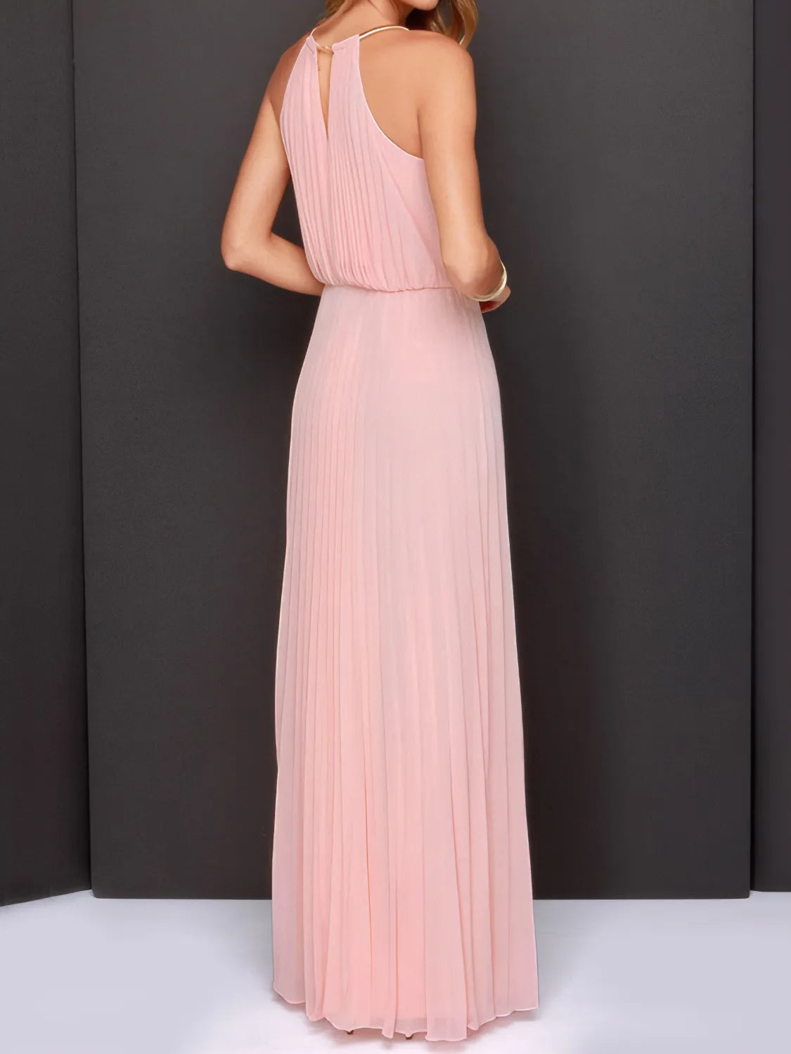 Blush pink halter backless maxi dress with thin straps and pleated skirt