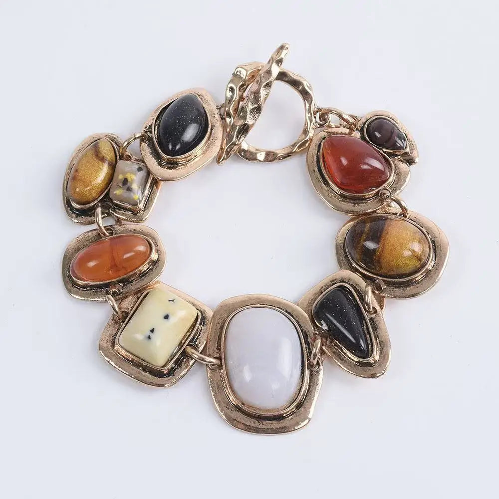 Gold-plated bohemian bracelet with mixed stones in black, brown, amber, red-orange, and white