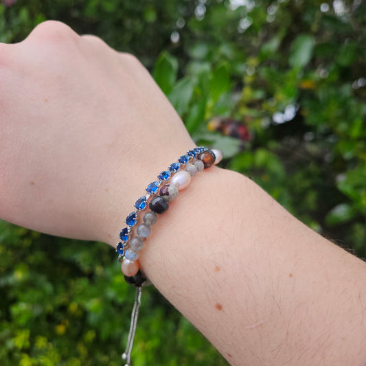 Blue and white zircon beaded bracelet on wrist with adjustable tie cord