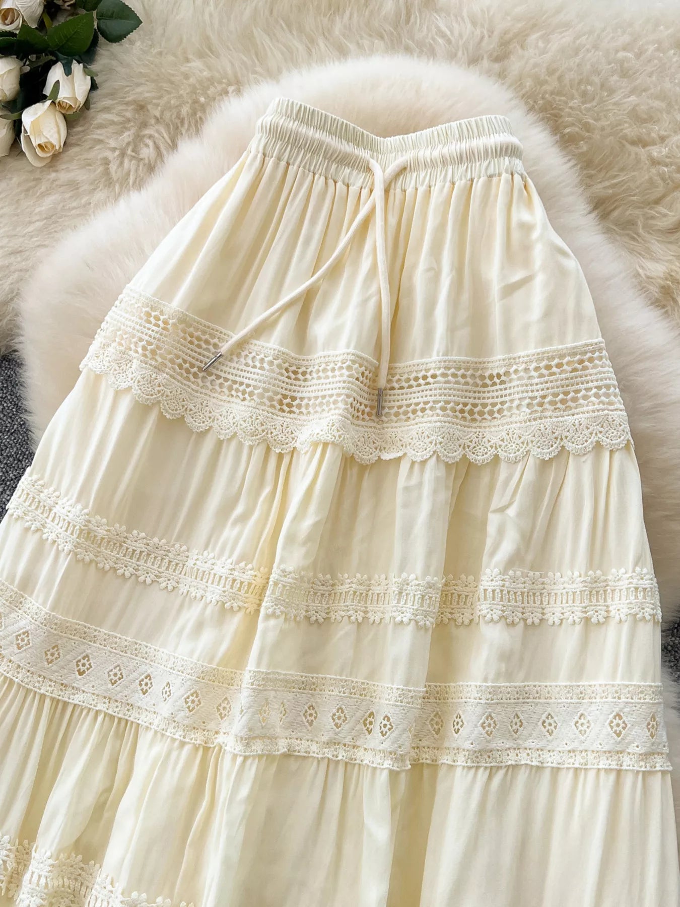 Cream lace-trim tiered skirt with gathered ruffles and elastic waistband