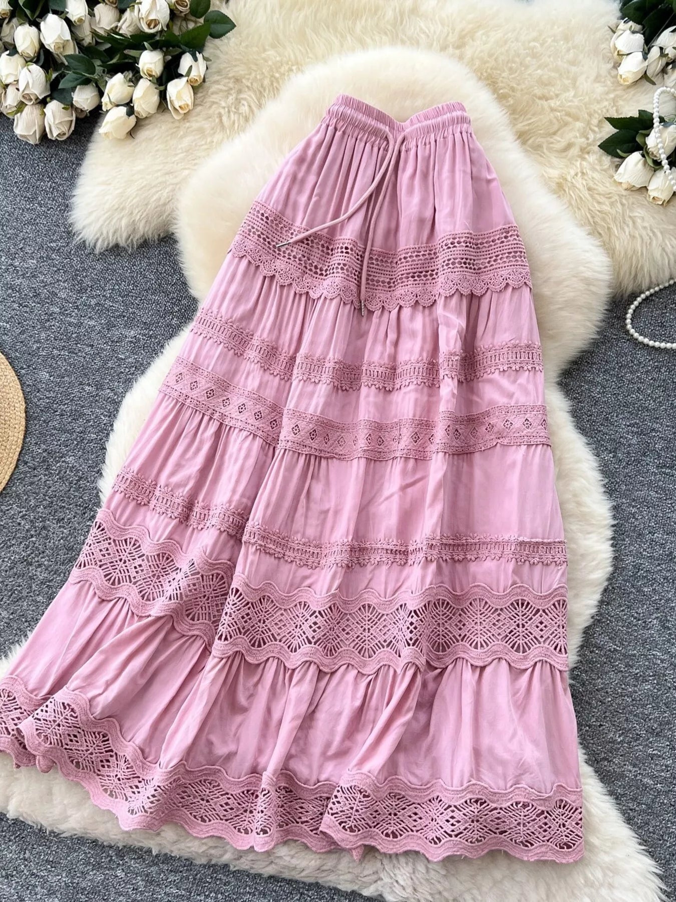 Pink tiered lace skirt with elastic waistband and crochet detailing