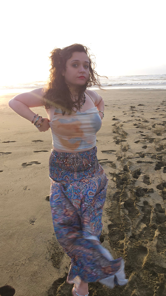 Person standing on a beach with a textured background